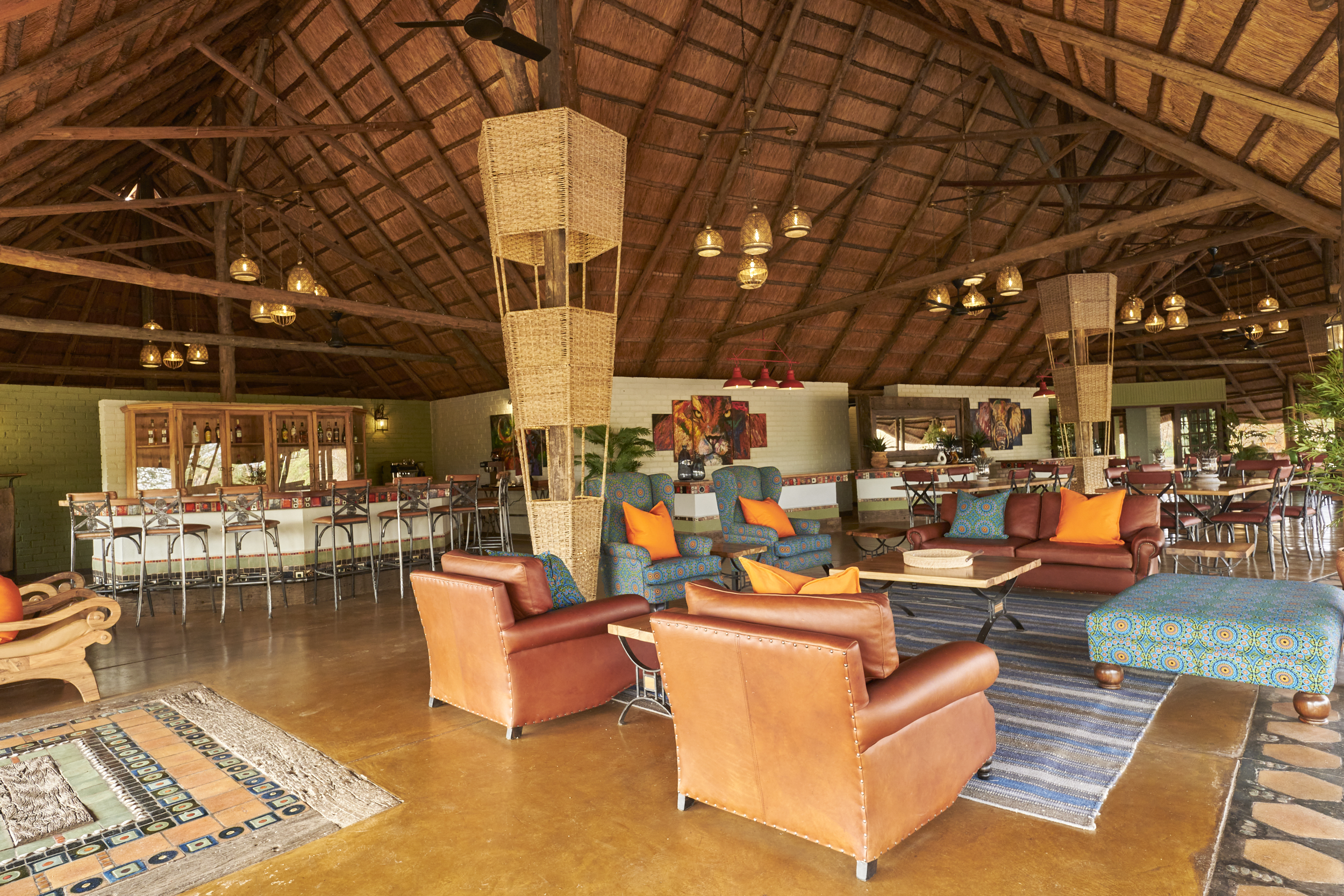 <p>The Wallow Lodge lounge area is stylish, comfortable, and a serene space with panoramic views of nature for guests to relax and unwind.</p>